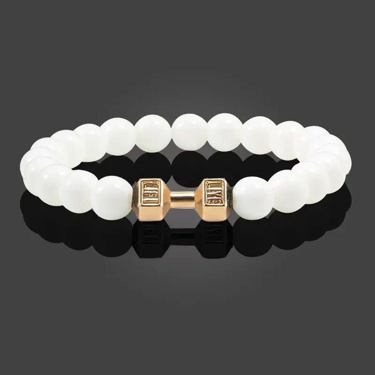 Intriguing white beaded bracelet with unique gold dumbbell charm, modern and stylish design