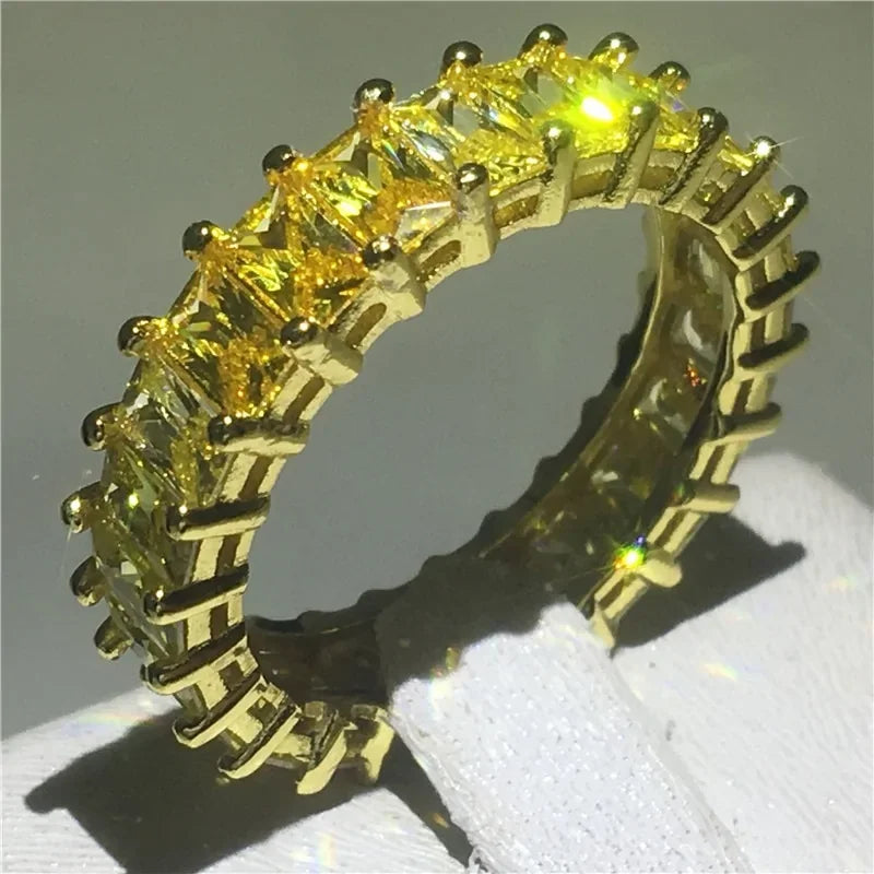 Radiant gold ring with sparkling yellow baguette gemstones, stunning in unique elegance