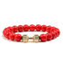 Vibrant red beaded bracelet with striking gold dumbbell charm, perfect for unique style