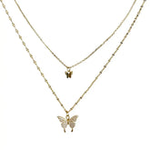 Chic layered gold butterfly necklace with sparkling crystal accents, perfect for unique style lovers