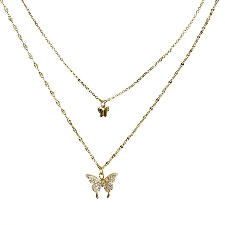 Chic layered gold butterfly necklace with sparkling crystal accents, perfect for unique style lovers