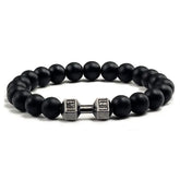 Matte black beaded bracelet with unique silver dumbbell charm, bold and stylish design.