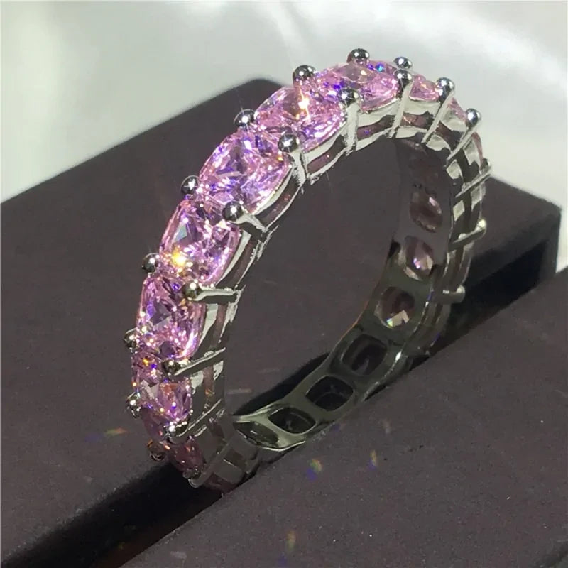 Elegant silver ring with sparkling pink gemstones, perfect for adding a unique touch to any style.