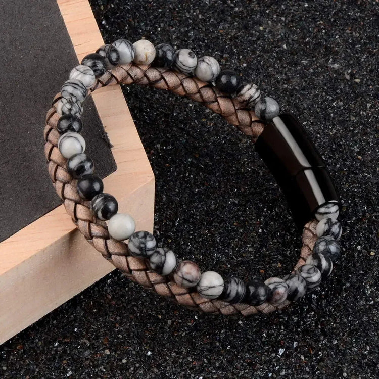 Stylish marble bead and braided leather bracelet with a unique black clasp, perfect for standout style.