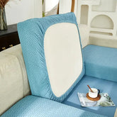 Inviting blue textured sofa cover with modern cushion, elevating unique home décor style.