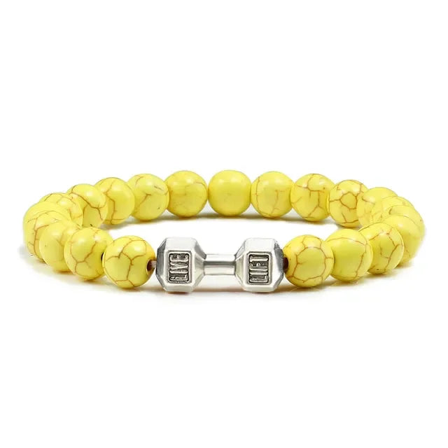 Bright yellow beaded bracelet with unique silver dumbbell charm, perfect for bold jewelry lovers