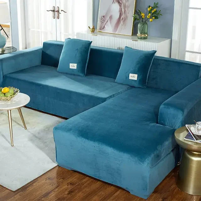 Inviting teal velvet sectional sofa adds a unique, stylish touch to modern living room décor.