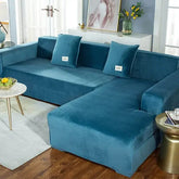 Inviting teal velvet sectional sofa adds a unique, stylish touch to modern living room décor.
