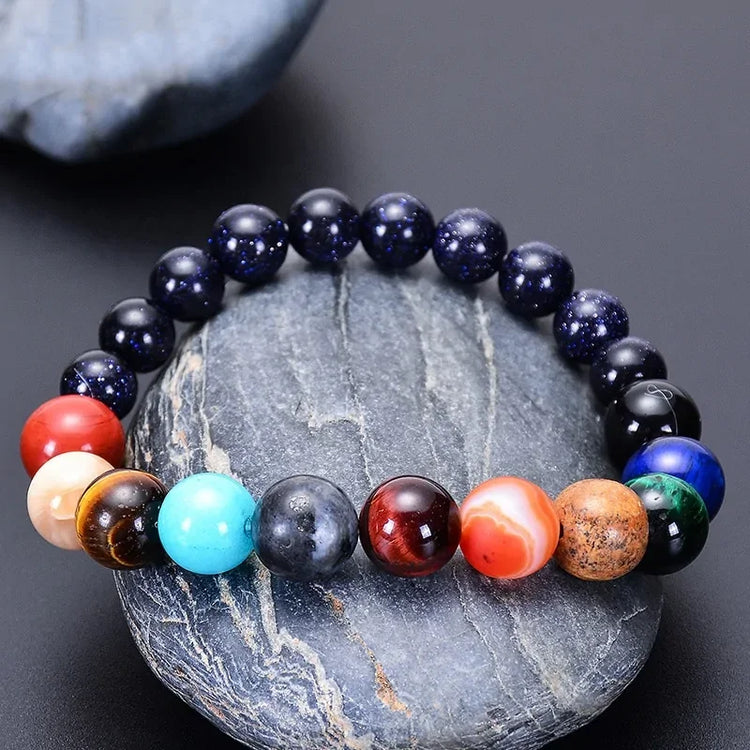 Vibrant multicolor gemstone beaded bracelet on smooth stone, unique jewelry for bold style
