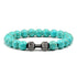 Eye-catching turquoise bead bracelet with unique dumbbell charm, perfect for bold style lovers.