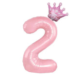 Chic pink number 2 balloon with whimsical crown, perfect for unique birthday décor