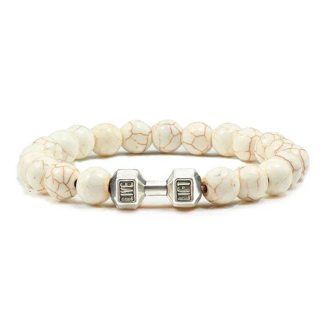 Intriguing white beaded bracelet with silver dumbbell charm, perfect for unique jewelry lovers.