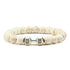 Intriguing white beaded bracelet with silver dumbbell charm, perfect for unique jewelry lovers.