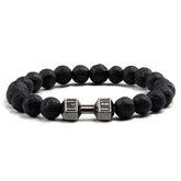 Distinctive black lava bead bracelet with a unique silver dumbbell charm, bold and stylish