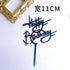 Unique blue acrylic Happy Birthday cake topper with elegant script beside ornate gold frame.