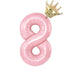 Playful pink number eight balloon with a shiny gold crown, a unique party décor accent.