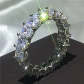 Brilliant eternity ring with sparkling stones in a unique prong setting, radiant under light