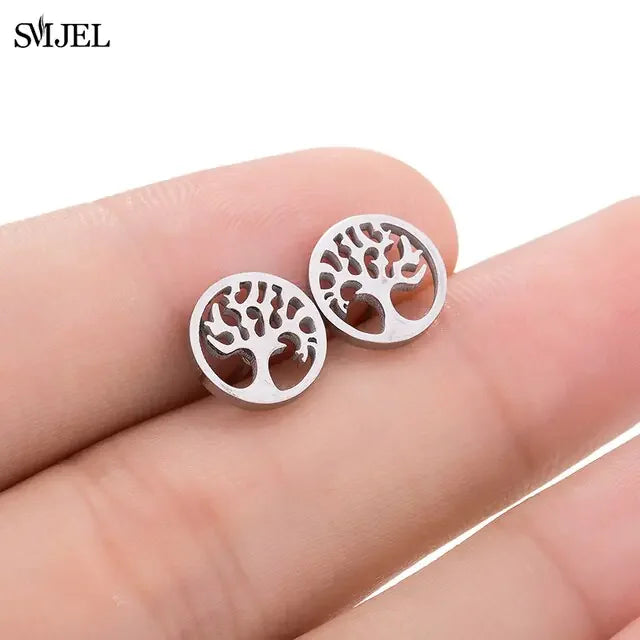 Intriguing silver tree of life stud earrings, unique jewelry detail on fingertips, stylish gift