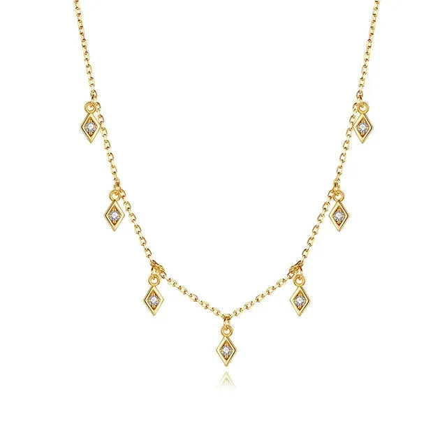 Elegant gold necklace with diamond-shaped charms and sparkling stones, uniquely stylish look
