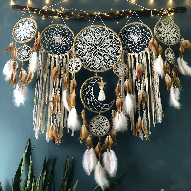Boho wall décor with intricate dreamcatchers, feathers, lace, and moon design for unique home style
