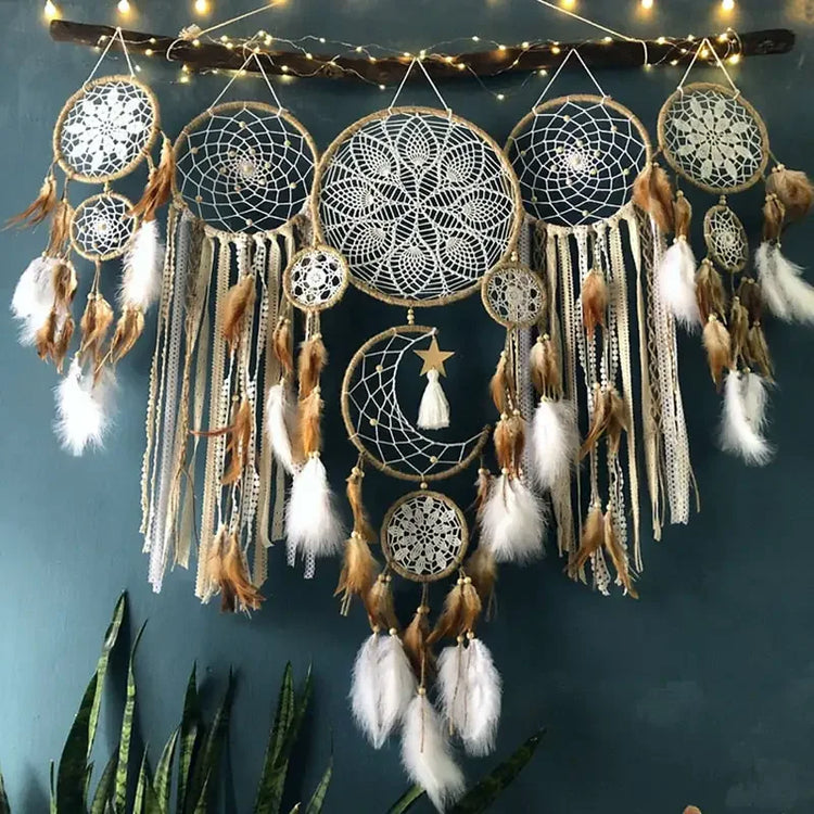 Boho wall décor with intricate dreamcatchers, feathers, lace, and moon design for unique home style