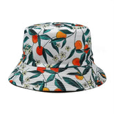 Bright floral and orange fruit pattern bucket hat, perfect for unique, stylish summer outfits.