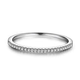 Elegant silver band ring with a row of sparkling diamonds, perfect for unique style lovers.