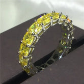 Dazzling silver ring with vibrant yellow gemstones, perfect for unique, stylish jewelry lovers.