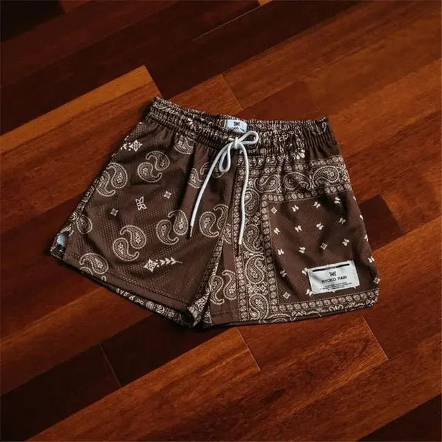 Intriguing brown patterned shorts with paisley and geometric prints, inviting a bold style upgrade.