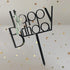 Sleek black Happy Birthday cake topper with gold star confetti, adding unique celebration flair.