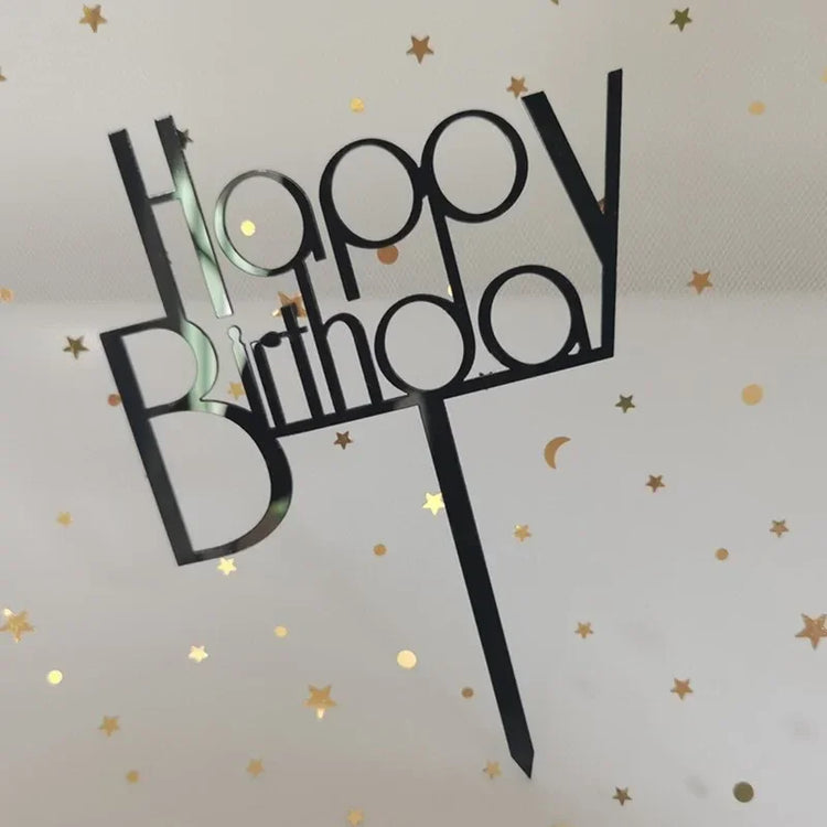 Sleek black Happy Birthday cake topper with gold star confetti, adding unique celebration flair.