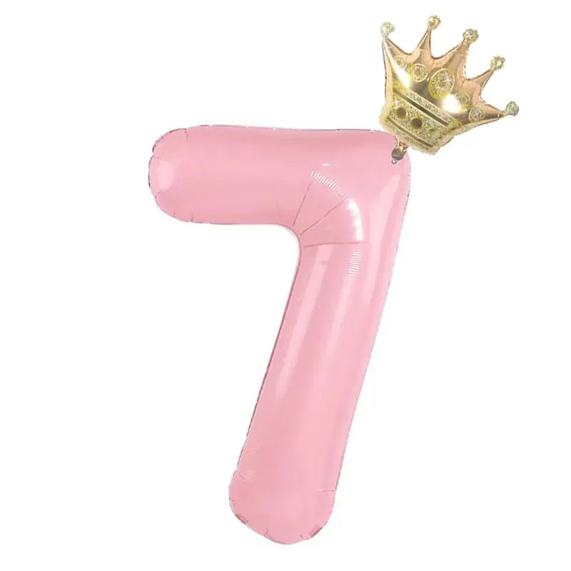Pink number seven balloon with gold crown, unique party décor for standout celebrations.