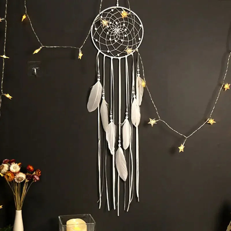 Elegant white dreamcatcher with feathers, fairy lights, and unique wall décor appeal