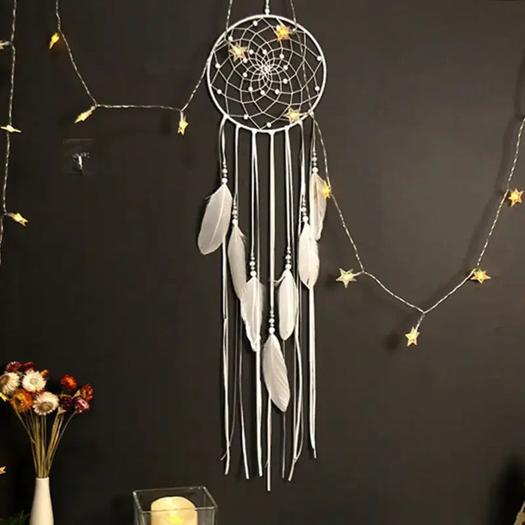 Elegant white dreamcatcher with feathers, fairy lights, and unique wall décor appeal