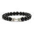 Sleek black beaded bracelet with unique silver dumbbell charm, perfect for bold style