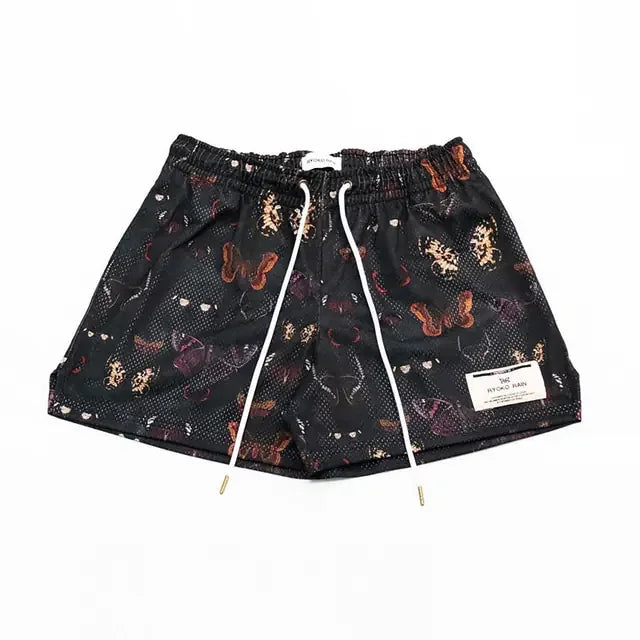 Unique black shorts with vibrant butterfly and animal print, elastic waist, stylish drawstring