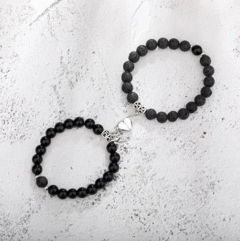 Unique black beaded bracelet set with heart charm, stylish gift for a bold, modern look