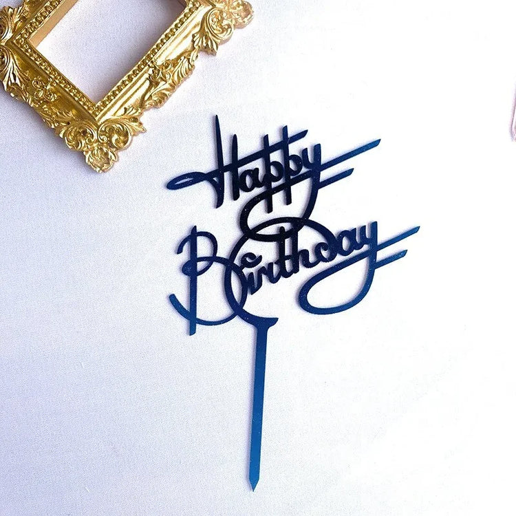Elegant blue acrylic Happy Birthday cake topper with a creative script beside a gold ornate frame