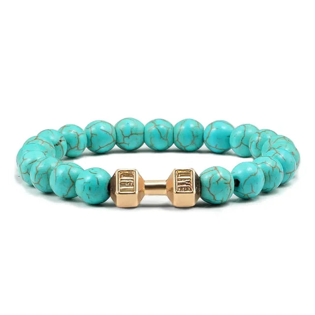 Vivid turquoise beaded bracelet with unique gold dumbbell accent, perfect for standout style.
