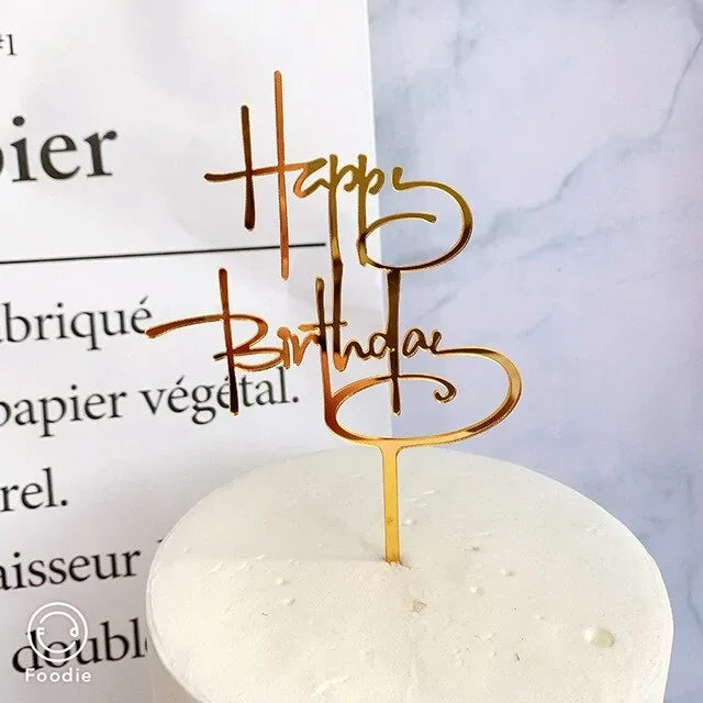 Elegant gold acrylic Happy Birthday cake topper, creating a unique celebration centerpiece.