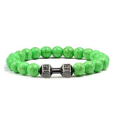 Eye-catching green beaded bracelet with unique dumbbell charm—modern, stylish jewelry accent.