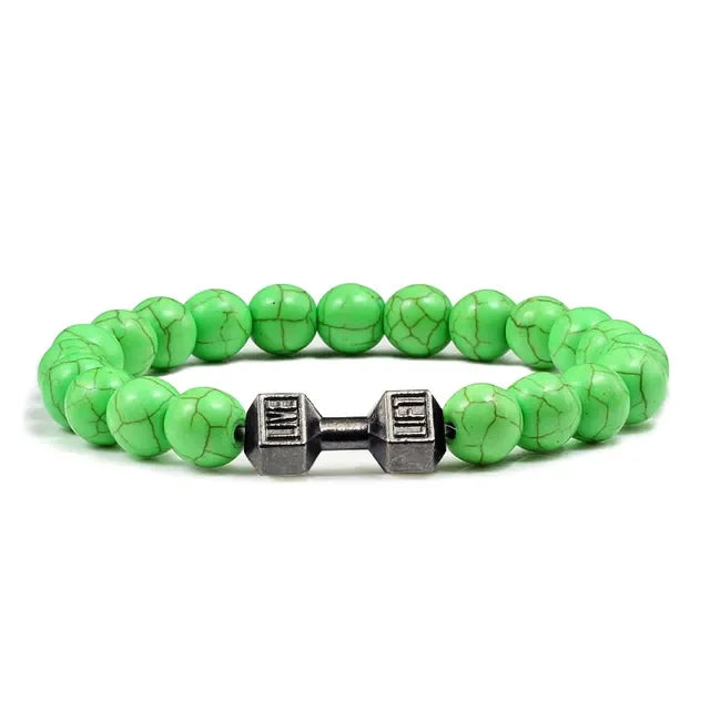 Eye-catching green beaded bracelet with unique dumbbell charm—modern, stylish jewelry accent.