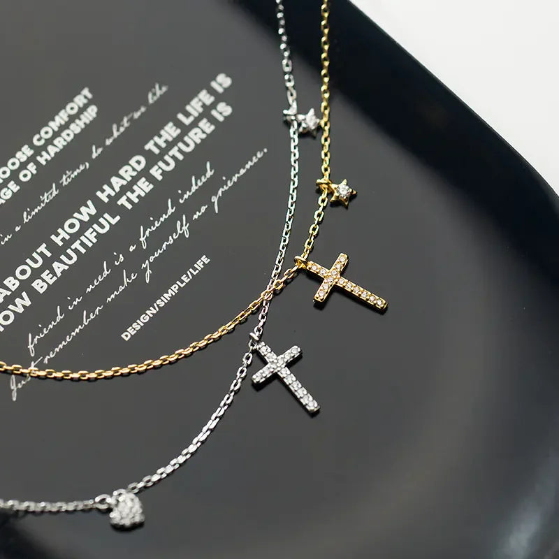 Elegant gold and silver cross necklaces with sparkling stones, perfect for a unique jewelry style.