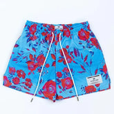 Vibrant blue floral shorts with bold red and purple flowers, unique design for summer style