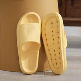 Chic yellow slip-on sandals with textured strap and non-slip sole, stylish comfort for home