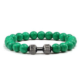 Striking green beaded bracelet with unique silver dumbbell charm, perfect for fitness lovers.