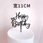 Elegant black Happy Birthday cake topper with heart accent, perfect for unique party décor