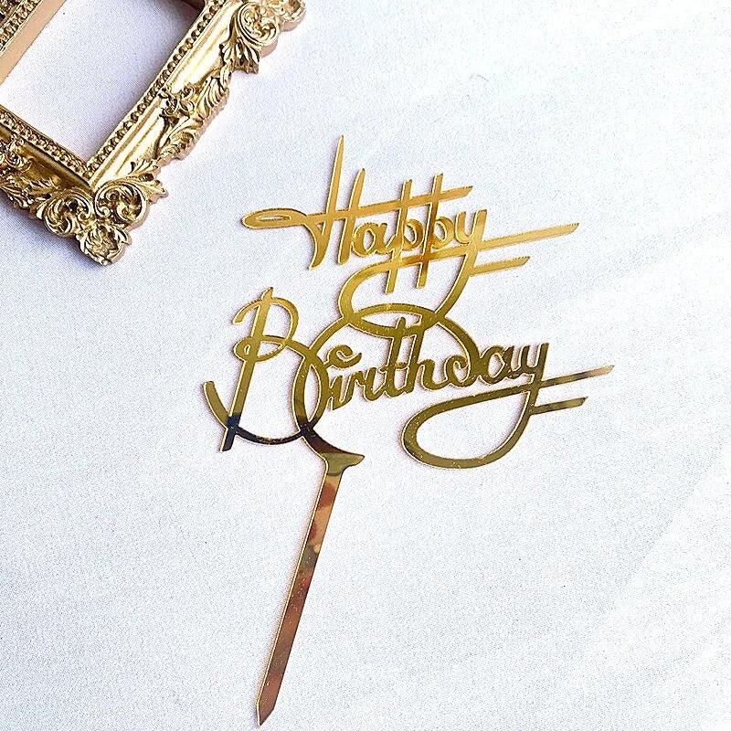Elegant gold Happy Birthday cake topper, stylish and unique party decoration on white surface