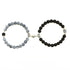 Unique matching set of black matte and crackle stone bead bracelets with intricate silver accents