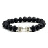Intriguing black lava stone bead bracelet with a unique silver dumbbell charm, perfect for stylish self-expression.